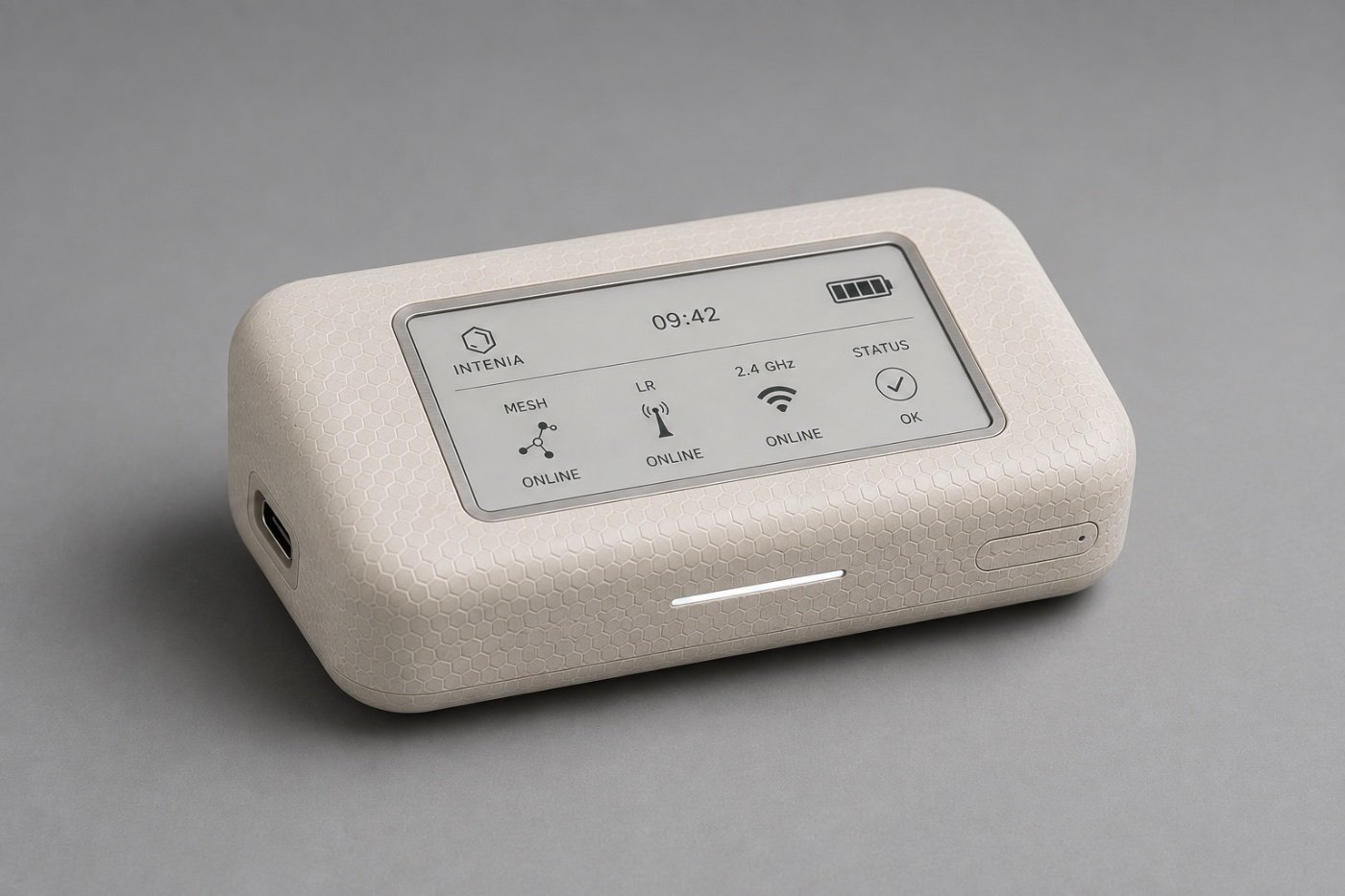 Field gateway: a grown composite enclosure with a hexagonal cell texture, an e-paper status display showing mesh, long-range and 2.4 GHz links online, and a USB-C port
